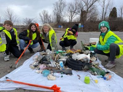 Fifth and sixth graders collect, sort, and count the various kinds of litter during a ‘pre-walleye run flash sweep’ of marine debris along the Maumee River. (Photo Credit: Amy Boros)