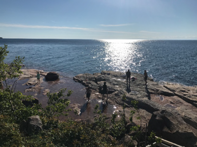 Students explore the lakeshore on a canoe trip supported by the Red Cliff Band of Lake Superior Chippewa and partner Apostle Islands National Lakeshore Park. (Credit: Alex Breslav)