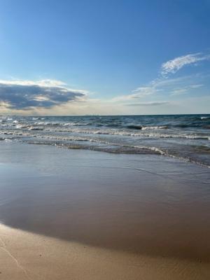 Shores of Lake Michigan from Miller Beach, Indiana. On the horizon is an outline of the City of Chicago. 