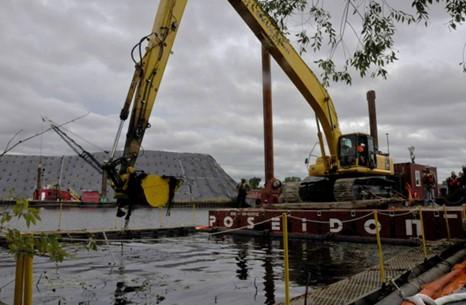 Mechanical dredging of contaminated sediment in Ryerson Creek in the Muskegon Lake AOC.