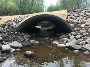 After photo of culvert replacement project. Water flows freely through the newly opened wider culvert