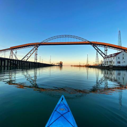 Kayak going under bridge on Ashtabula River. (Credit: Brandon and Alexa Hart) 