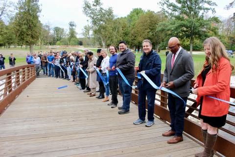 Kenosha County Executive Jim Kreuser and other dignitaries cut the ribbon on the Phase 2 Pike River restoration within Kenosha County Parks' Petrifying Springs Park. Credit: Kenosha County Parks.