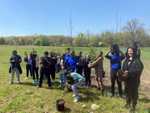 Euclid students planting the project’s first trees on May 5, 2023. Courtesy photo by Cleveland Metroparks.