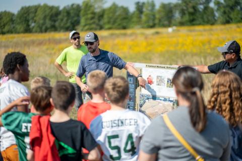 USACE Buffalo District project manager Tim Noon and Chad Toussant of the U.S. Geological Survey speak to students about the functions and purpose of the Phosphorus Optimal Wetland Demonstration Project. (Credit: Andre Hampton, USACE)