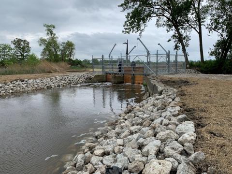 Two new electric pumps were installed at the Magee Marsh Wildlife Area. Raised gates to the right of the pump structure and bubbles in the water indicate the pumps are running. (after)