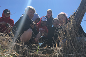 "Students spot a snapping turtle while participating in a wetland monitoring in Port Wing, Wisconsin. (Photo credit: Wisconsin Department of Natural Resources)	"