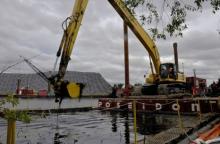 Mechanical dredging of contaminated sediment in Ryerson Creek in the Muskegon Lake AOC.