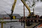 Mechanical dredging of contaminated sediment in Ryerson Creek in the Muskegon Lake AOC.
